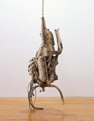 Artificial Life in the Valley of the World, 1994, Automobile engine and python snakeskin, 84 x 24 x 22 in.